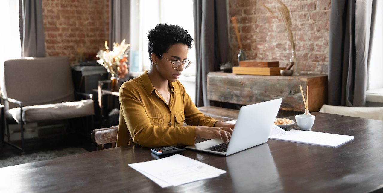 A person working on a laptop.