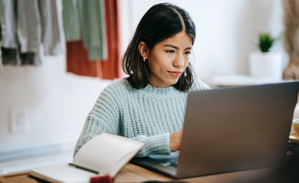 A stock image of a woman on a computer