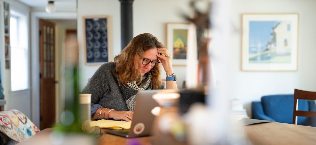 Adult learner working on a laptop