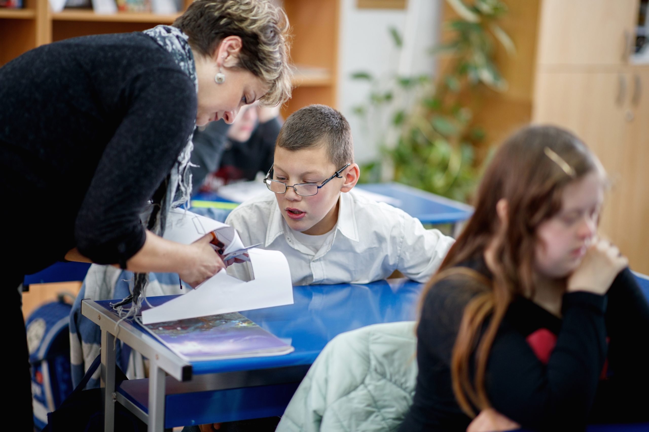 Teacher helping student with special needs